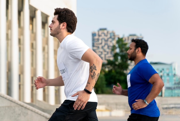 Medium shot men running on stair