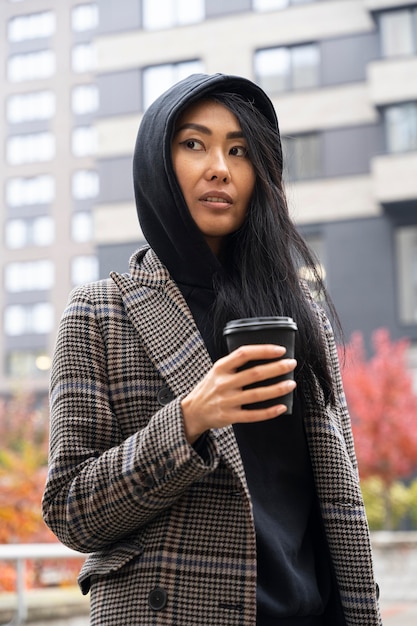 Medium shot model holding coffee cup