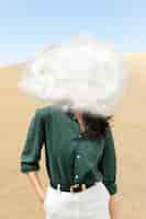 Free photo medium shot model posing with cloud-shaped head