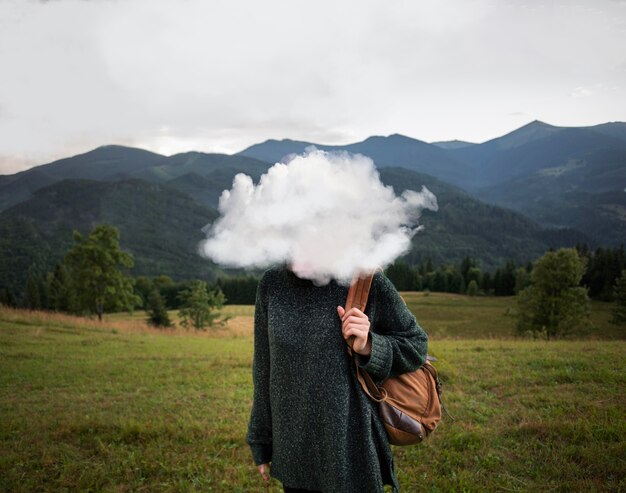 Medium shot model posing with cloud-shaped head