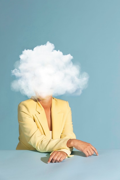 Free photo medium shot model posing with cloud-shaped head