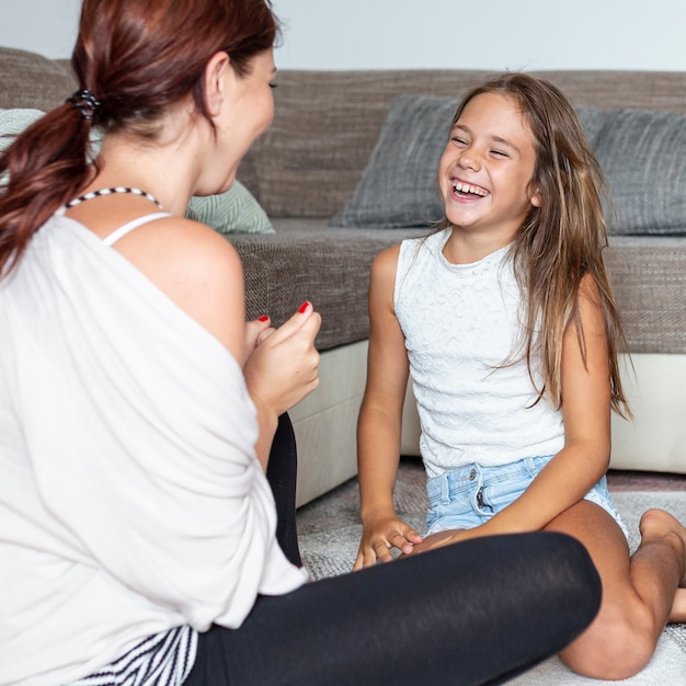 Medium shot of mother and daughter having fun