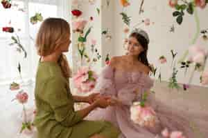 Free photo medium shot mother and girl at quinceanera party