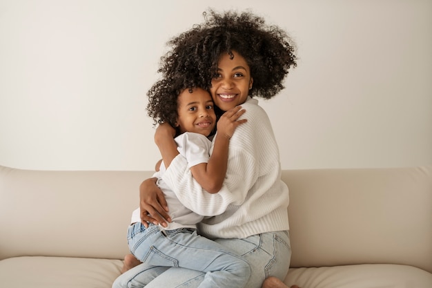 Free photo medium shot mother hugging kid