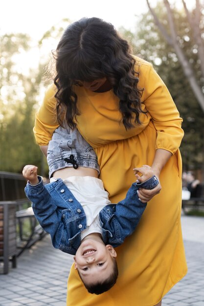 Medium shot mother playing with boy