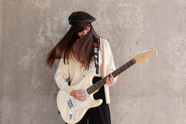 Medium shot musician playing guitar