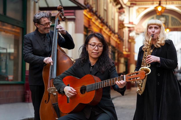 Medium shot musicians making jazz music outside