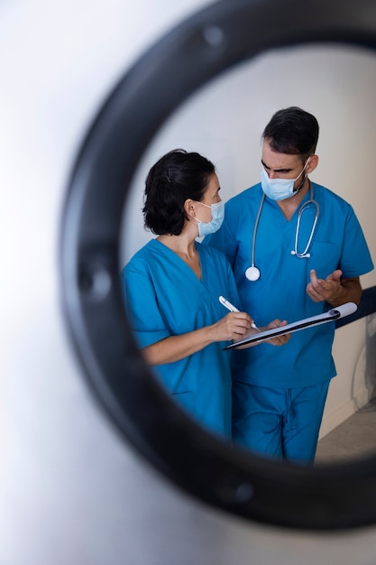 Medium shot nurses chatting at work