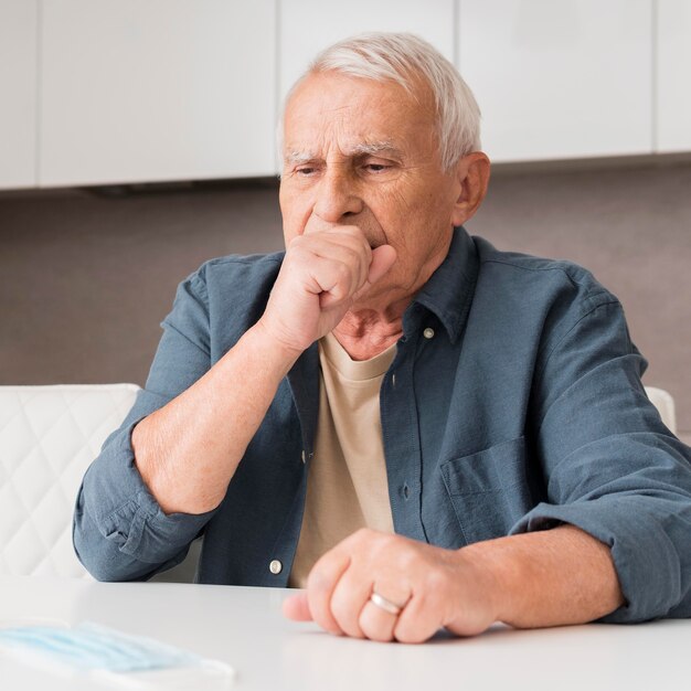 Medium shot old man coughing