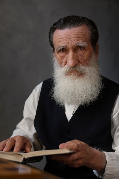 Free photo medium shot old man with book