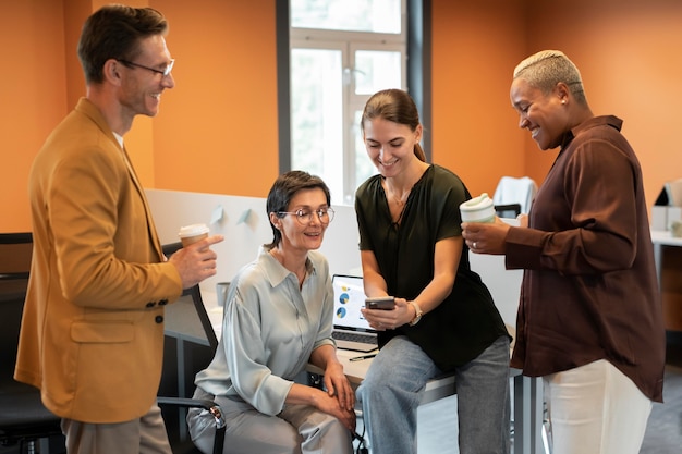 Free Photo medium shot people discussing at work