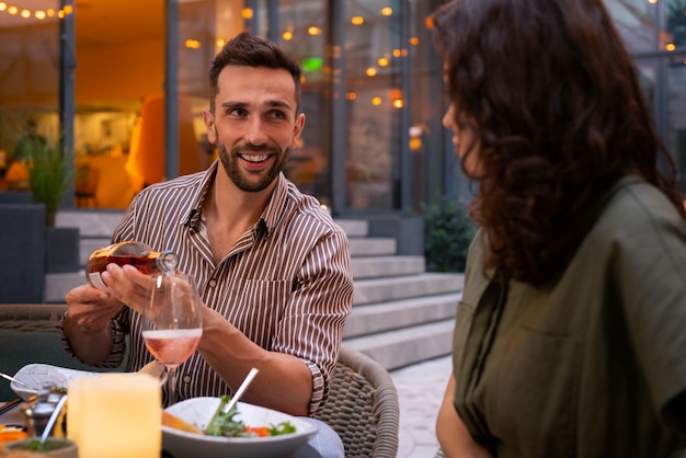 Free Photo medium shot people  enyoing a dinner party