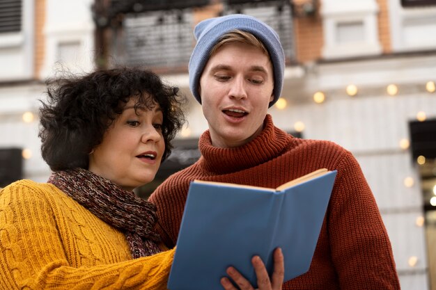 Medium shot people holding book