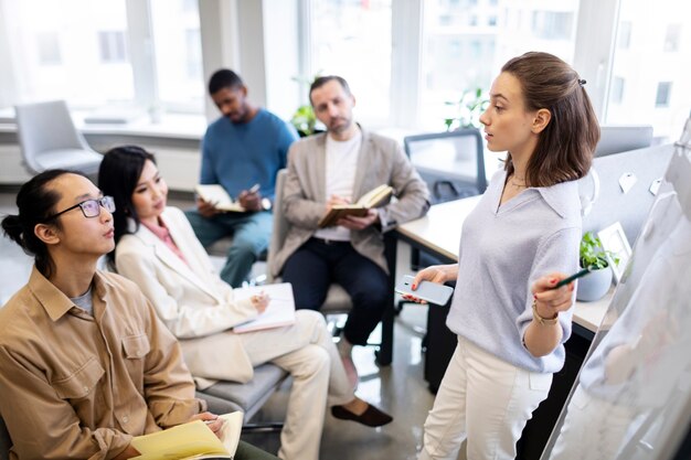 Medium shot people learning language at work