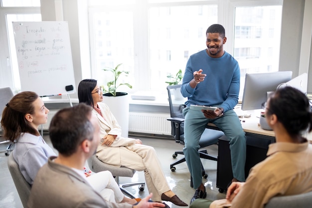 Medium shot people learning at office