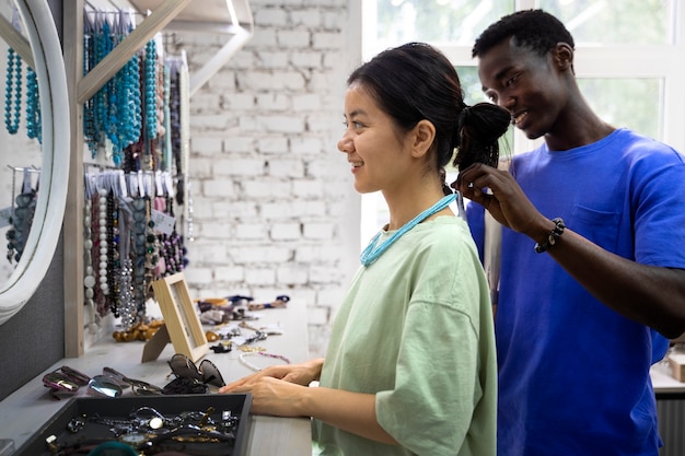 Medium shot people looking at jewelry