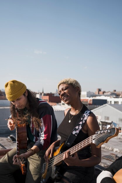 Medium shot people playing guitars