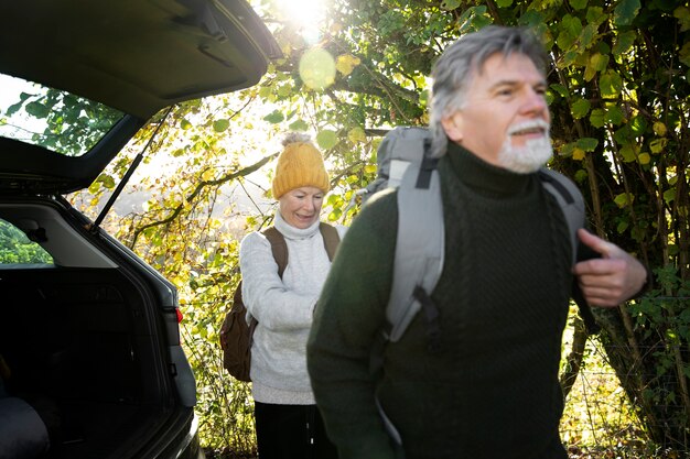 Medium shot people walking in nature