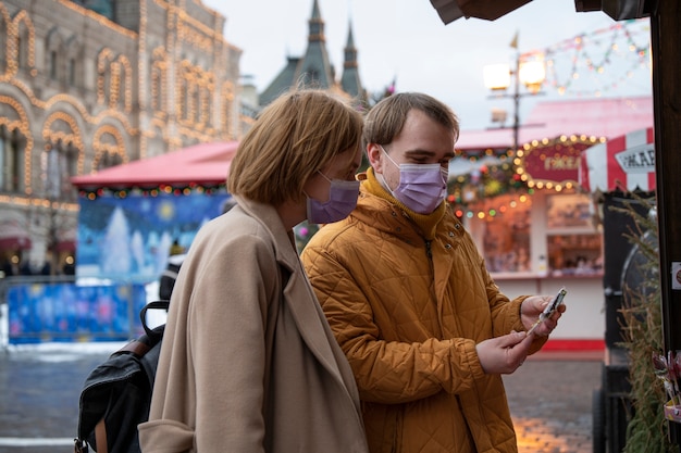 Free Photo medium shot people wearing face masks