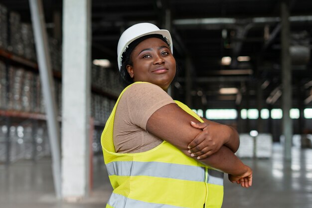 Medium shot plus-size woman working in construction