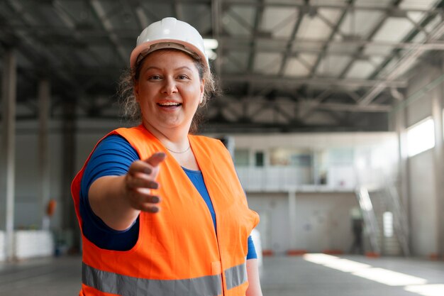 Medium shot plus-size woman working in construction