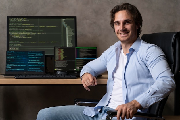 Medium shot programmer sitting on chair