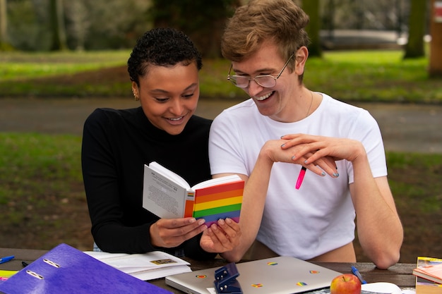 Free photo medium shot queer students outdoors