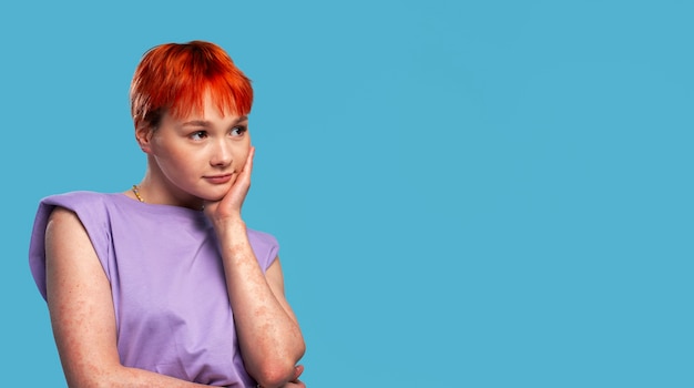 Medium shot queer woman posing with copy space