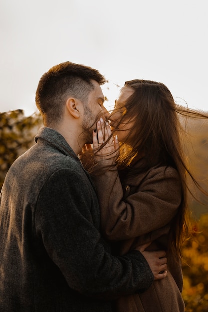 Medium shot romantic couple outside