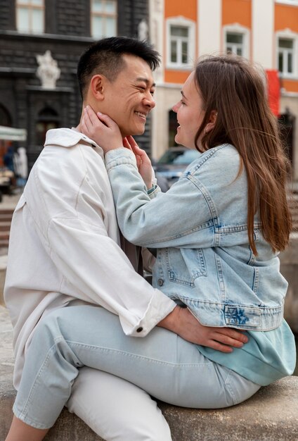 Medium shot romantic couple sitting