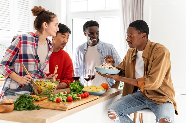 Medium shot roommates looking at plate