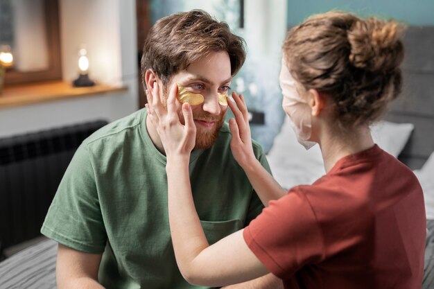 Medium shot roommates practicing skincare