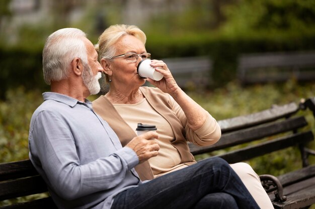 Medium shot senior couple drinking  coffee