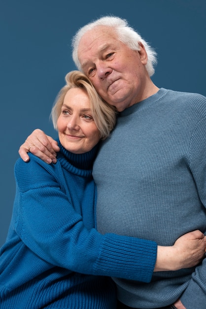 Medium shot senior couple posing together