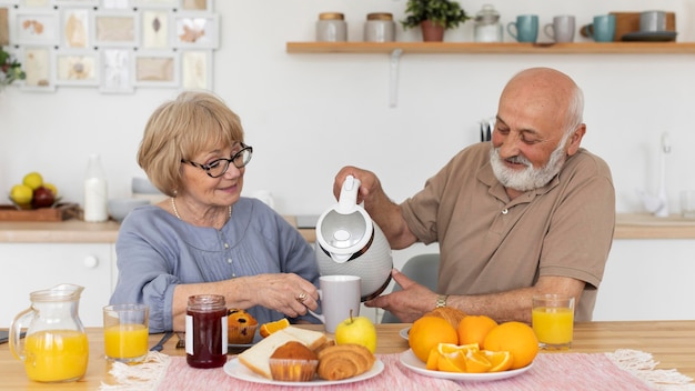 Medium shot senior couple at table