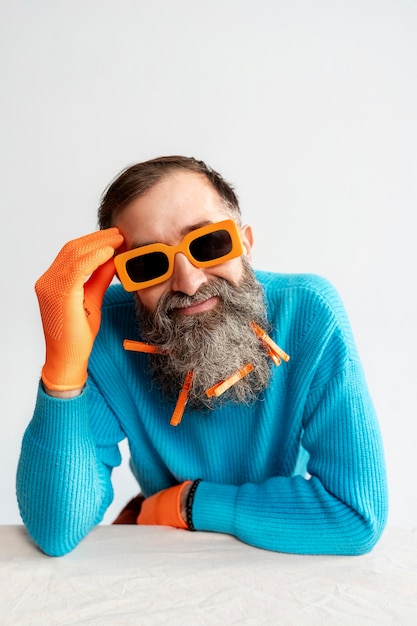 Free Photo medium shot senior man posing in studio