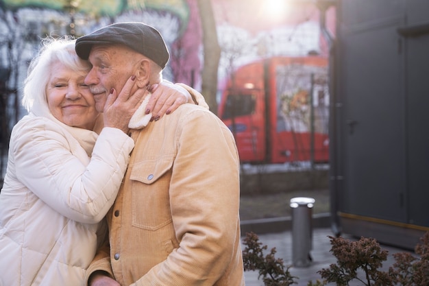 Medium shot senior people hugging