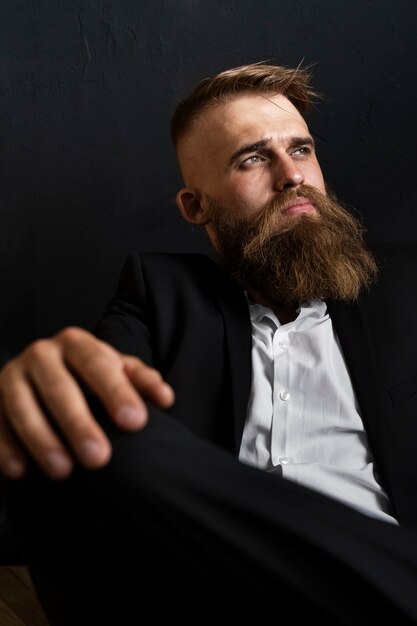 Medium shot sensitive man posing in studio