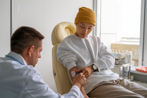 Medium shot sick man sitting on chair