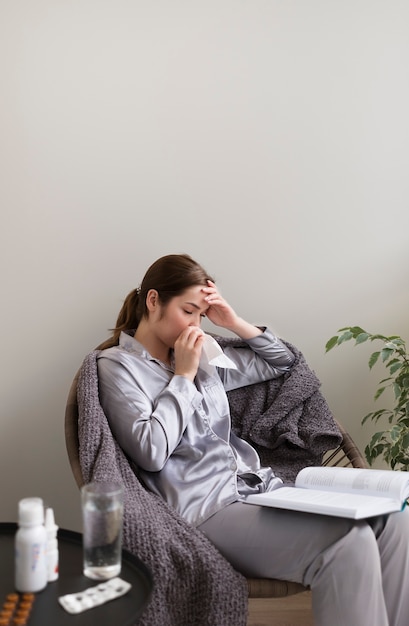 Free Photo medium shot sick woman at home