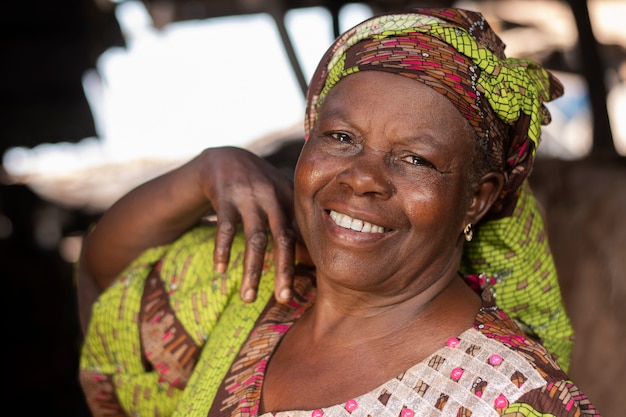 Medium shot smiley african woman outdoors