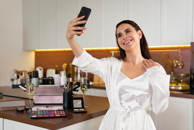 Medium shot smiley bride taking selfie