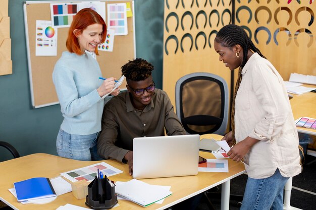 Medium shot smiley colleagues at work