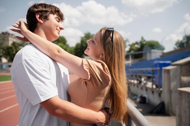 Medium shot smiley couple outdoors