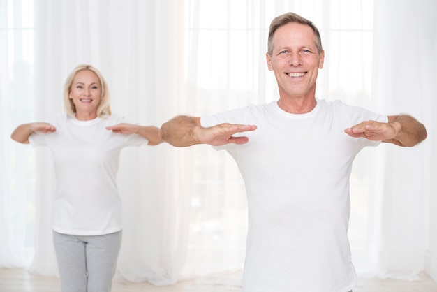 Medium shot smiley couple training together