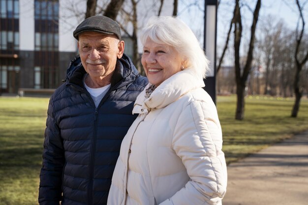 Medium shot smiley couple walking together