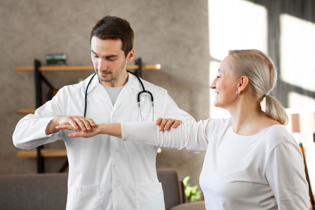 Medium shot smiley doctor checking woman