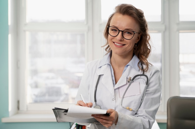 Medium shot smiley doctor with white coat