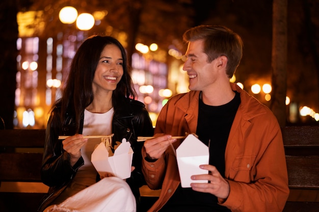 Medium shot smiley friends eating together