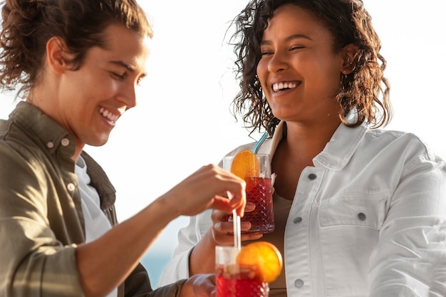 Medium shot smiley friends with tasty sangria